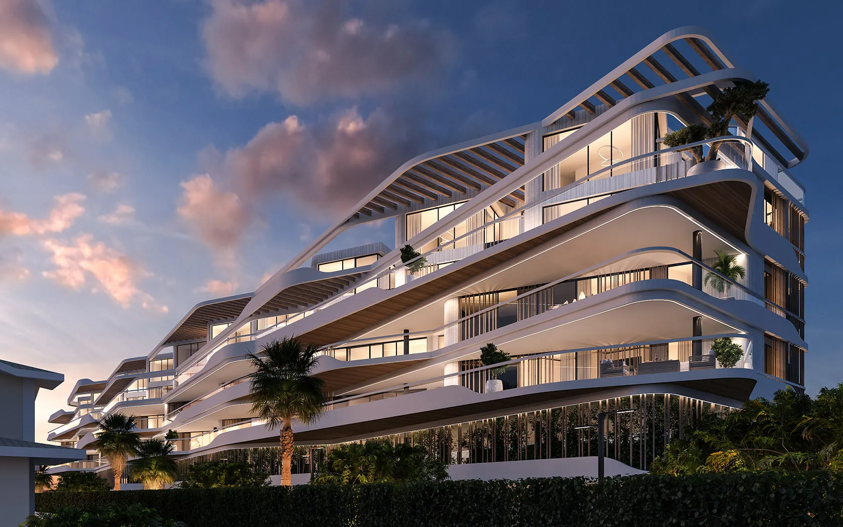 Fachada curva del Residencial La Patá al atardecer